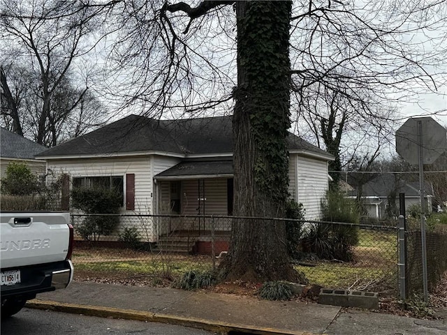 bungalow-style house with a fenced front yard