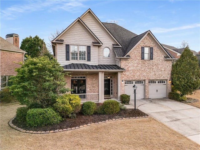 view of front of property with a garage and a porch