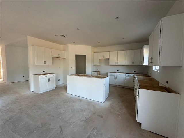 kitchen featuring white cabinetry and a kitchen island