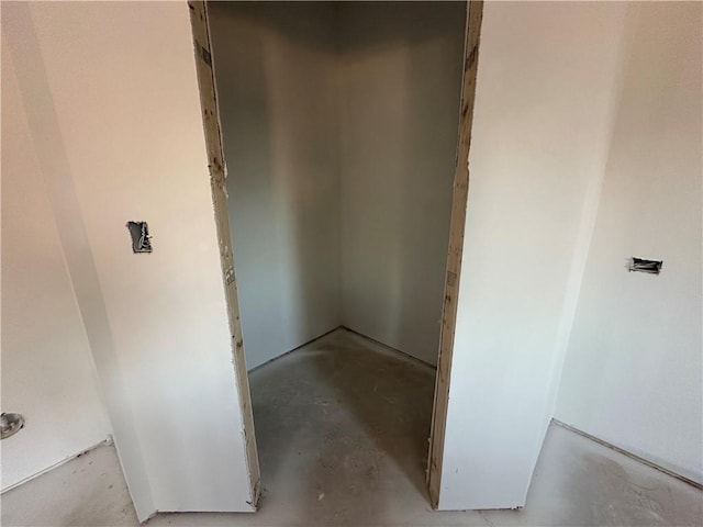 bathroom with concrete flooring