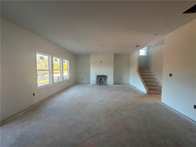 unfurnished living room with a healthy amount of sunlight