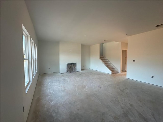 unfurnished living room with plenty of natural light