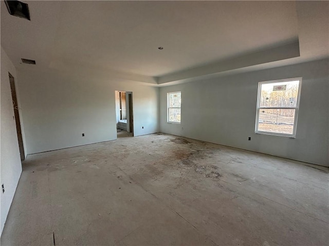 spare room featuring a raised ceiling