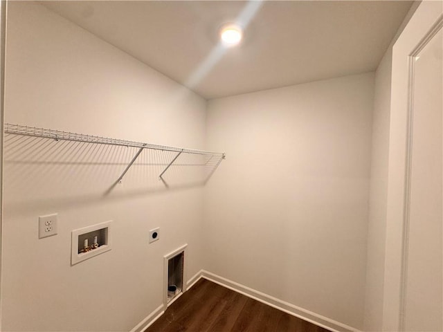 laundry area with dark wood finished floors, hookup for a washing machine, electric dryer hookup, laundry area, and baseboards