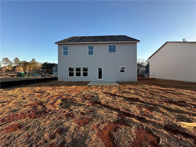 back of house with a patio