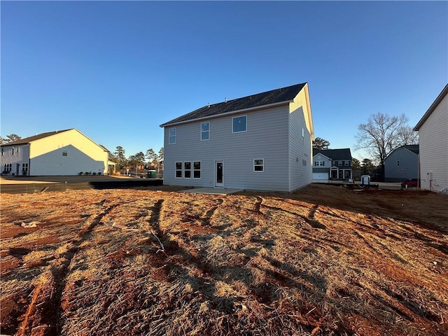 back of property featuring a patio