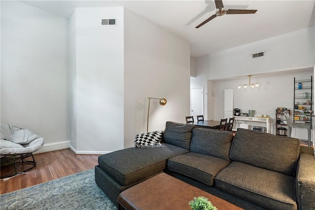 1031 State St NW Unit 106, Atlanta, GA 30318 - living room featuring wood finished floors, ceiling fan, a chandelier, and baseboards