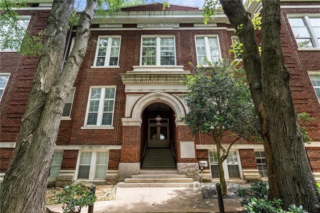 1031 State St NW Unit 106, Atlanta, GA 30318 - georgian-style home featuring brick siding