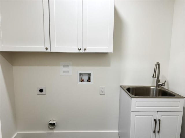 laundry area with sink, hookup for a washing machine, cabinets, and hookup for an electric dryer