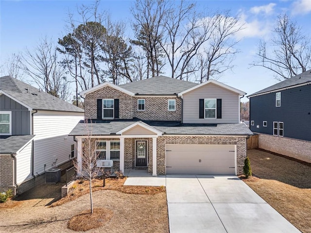 view of front of house featuring brick siding, central air condition unit, concrete driveway, roof with shingles, and a garage