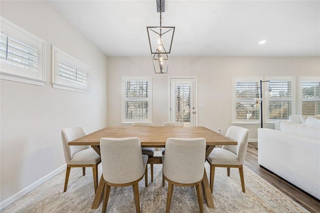 dining area with recessed lighting, baseboards, a wealth of natural light, and light wood-type flooring