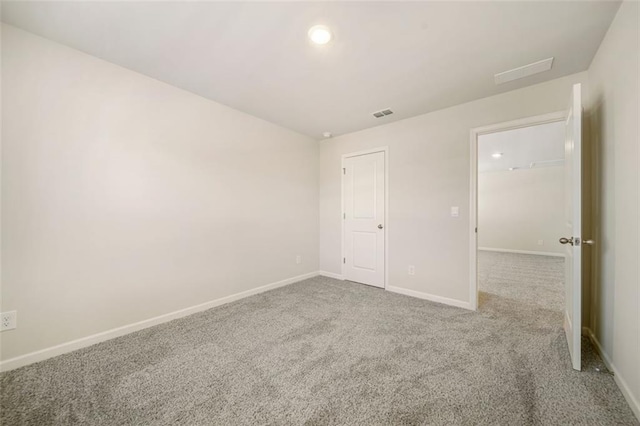 unfurnished bedroom featuring carpet flooring, visible vents, and baseboards