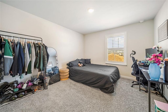 carpeted bedroom with baseboards