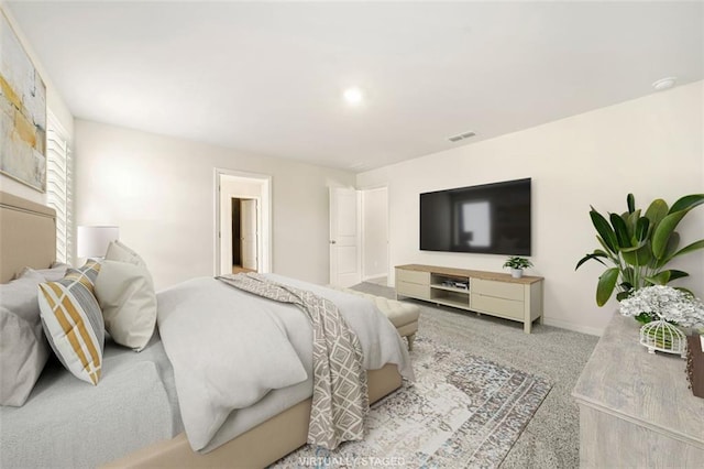 carpeted bedroom featuring baseboards