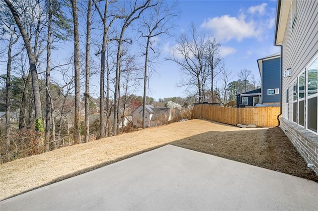 view of yard with a patio area and fence