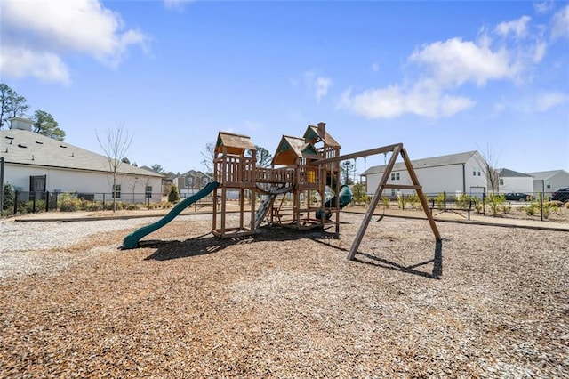 community jungle gym featuring a residential view and fence