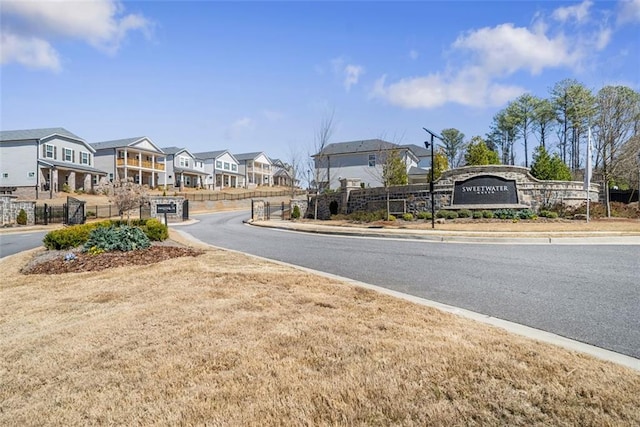 view of street featuring a residential view, curbs, and sidewalks