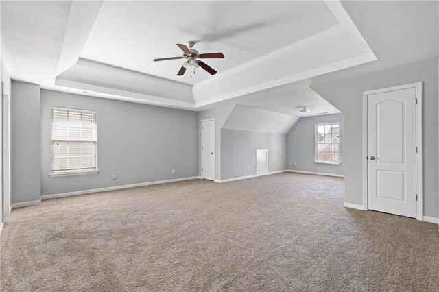 additional living space with carpet flooring, ceiling fan, and baseboards