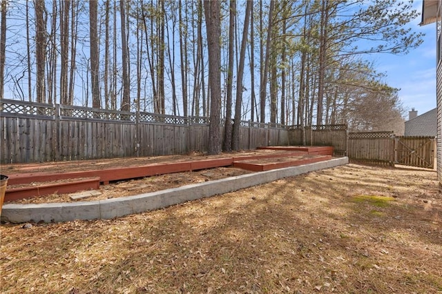 view of yard with a fenced backyard