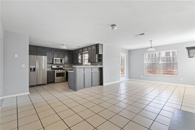 kitchen featuring open shelves, stainless steel appliances, visible vents, backsplash, and light tile patterned flooring