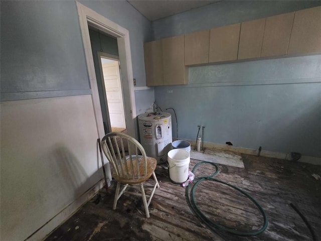 1435 Troupe St, Augusta, GA 30904 - kitchen featuring water heater and cream cabinetry