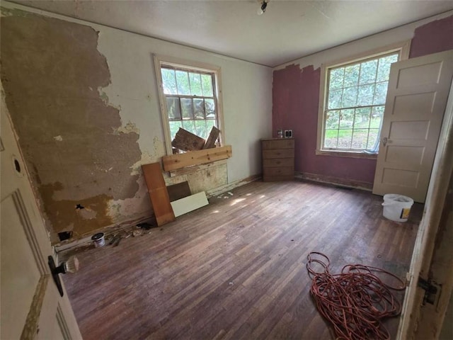 1435 Troupe St, Augusta, GA 30904 - unfurnished bedroom featuring wood finished floors, multiple windows, and baseboards