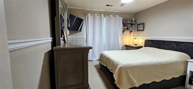 bedroom featuring ceiling fan and carpet floors