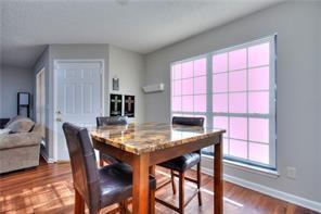 586 Windchase Ln, Stone Mountain, GA 30083 - dining space with baseboards, plenty of natural light, and dark wood finished floors