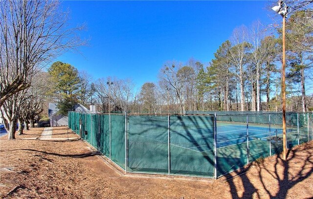 586 Windchase Ln, Stone Mountain, GA 30083 - view of tennis court with fence