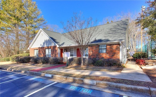 586 Windchase Ln, Stone Mountain, GA 30083 - view of front of home featuring uncovered parking and brick siding