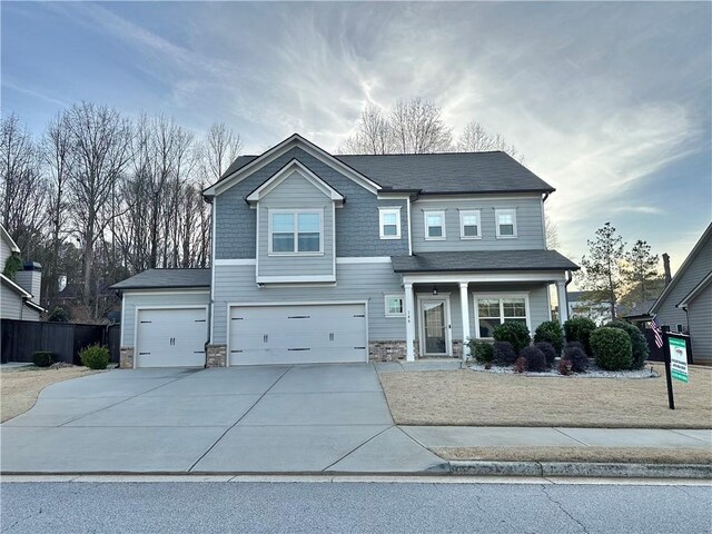 view of front of home featuring a garage and a front yard