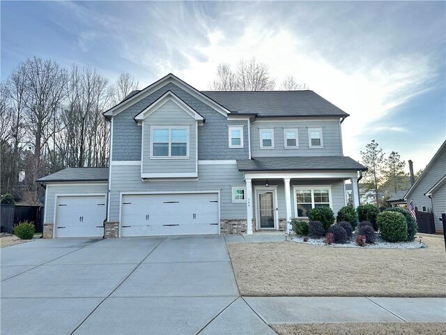 view of front of home featuring a garage and a front lawn