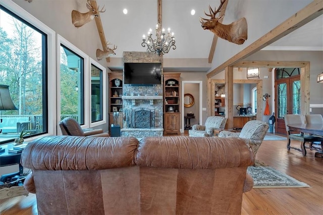 living room with a stone fireplace, high vaulted ceiling, light hardwood / wood-style floors, and beam ceiling