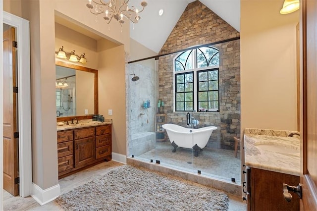 bathroom with a notable chandelier, shower with separate bathtub, lofted ceiling, and vanity