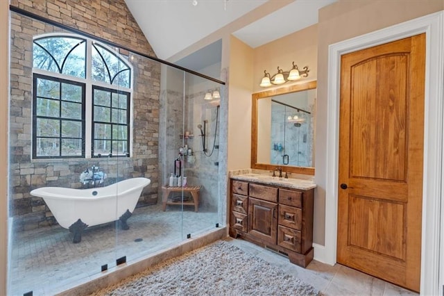 bathroom with vanity, independent shower and bath, tile patterned floors, and vaulted ceiling