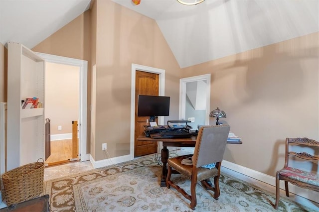 office with hardwood / wood-style floors and vaulted ceiling