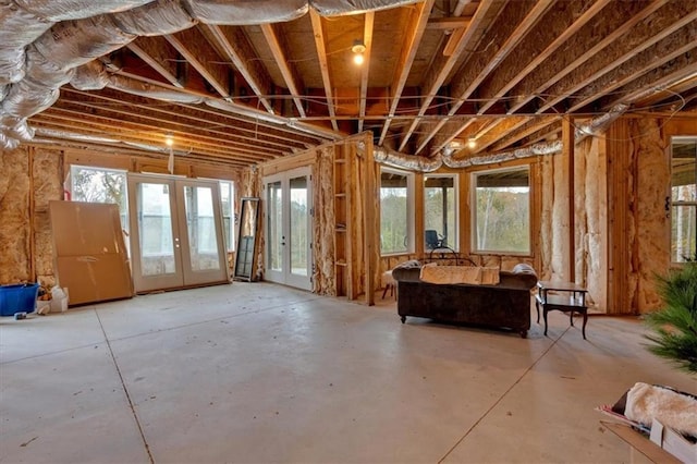 misc room featuring concrete floors and french doors