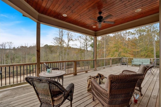 wooden deck featuring ceiling fan