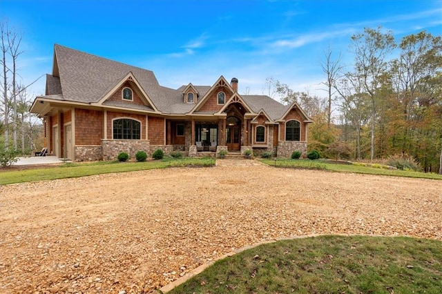 craftsman-style house with a porch and a garage