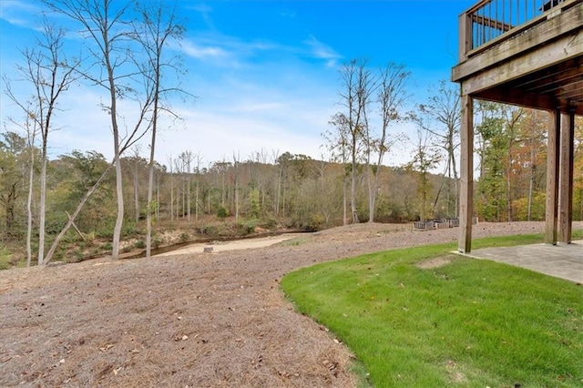 view of yard with a wooden deck