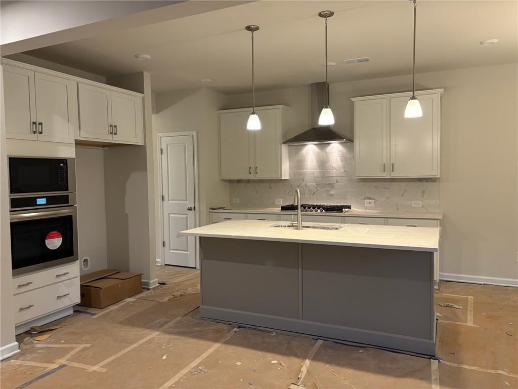 kitchen featuring white cabinets, wall chimney exhaust hood, oven, black microwave, and backsplash