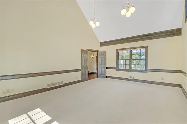 unfurnished room with high vaulted ceiling, a chandelier, and visible vents
