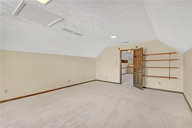 bonus room with light colored carpet, a textured ceiling, baseboards, and vaulted ceiling