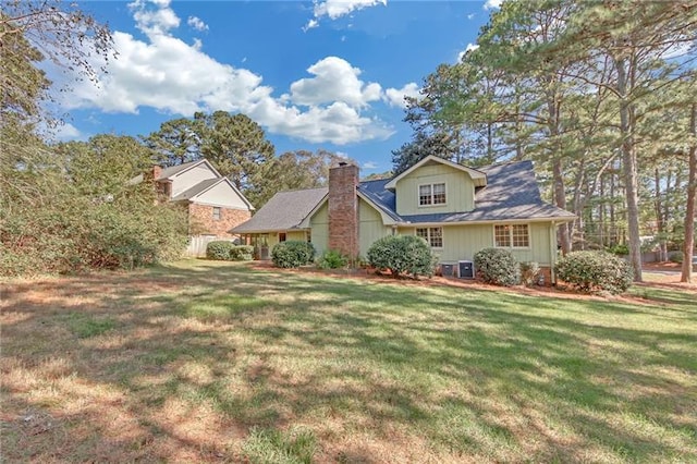 exterior space featuring a yard and a chimney