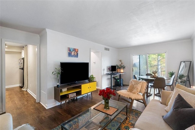 living room with dark hardwood / wood-style floors and crown molding