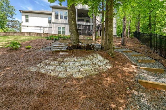 back of house with fence