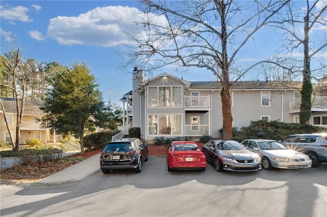 view of front of home featuring a balcony