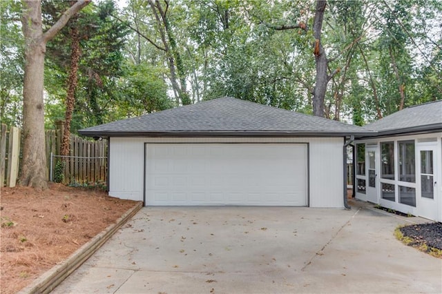 garage featuring fence