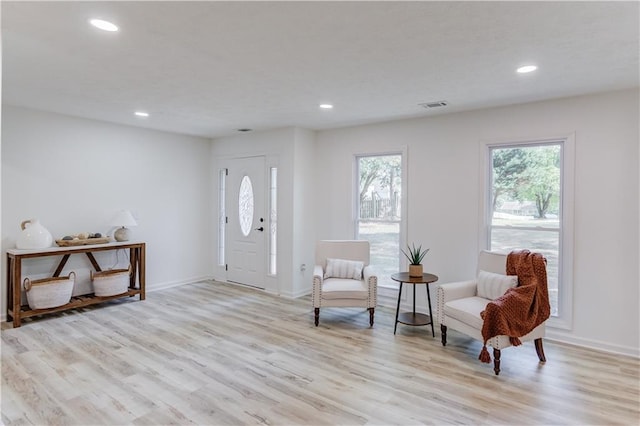 foyer featuring recessed lighting, visible vents, light wood-style flooring, and baseboards