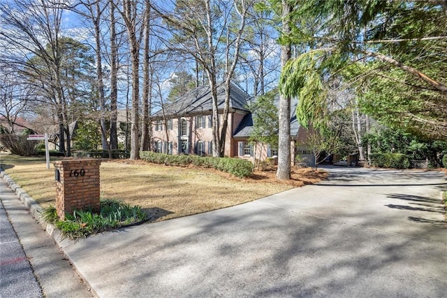 view of front of property with a front yard and driveway